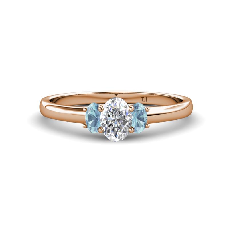 Gemma 7x5 mm Oval Cut Lab Grown Diamond and Aquamarine Trellis Three Stone Engagement Ring 